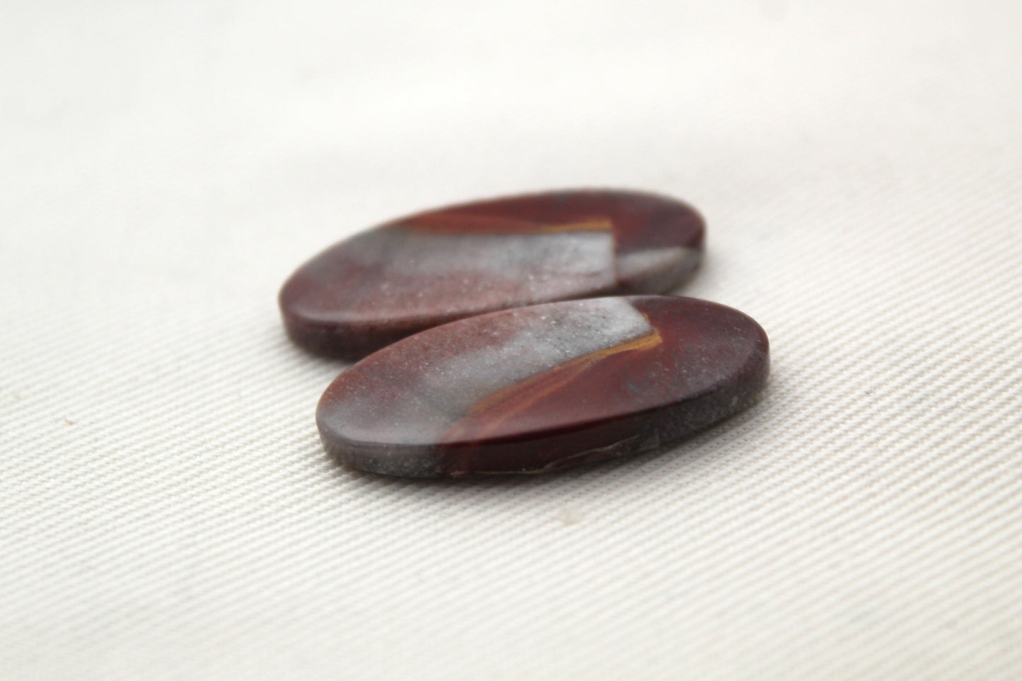 Mookaite pair oval cabochons red purple
