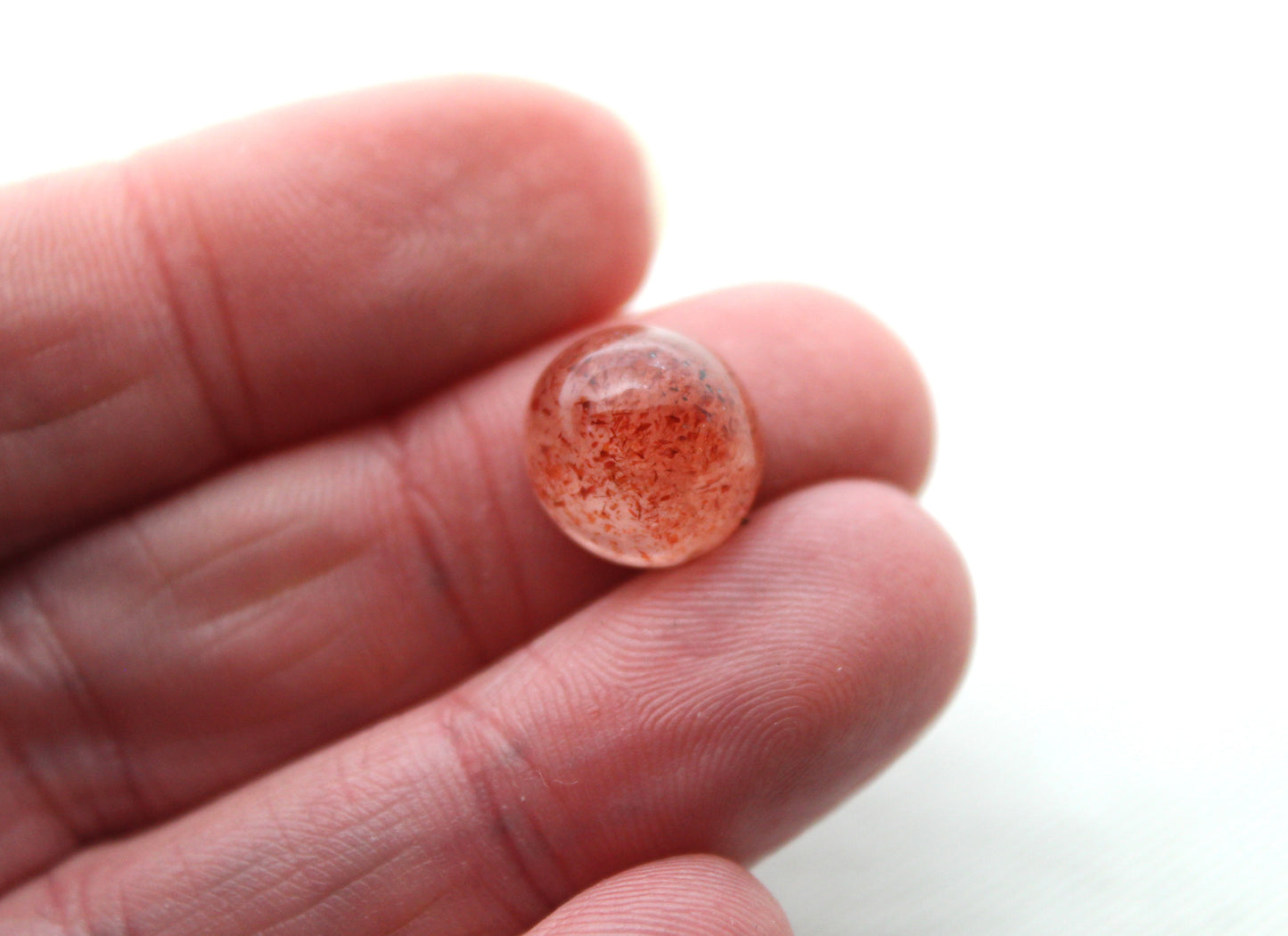 <tc>Deux petits Cabochons facettés de Quartz avec inclusions de Lepidocrocite</tc>