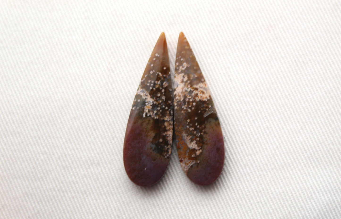 Pair of Petrified Wood Cisero Cabochons purple