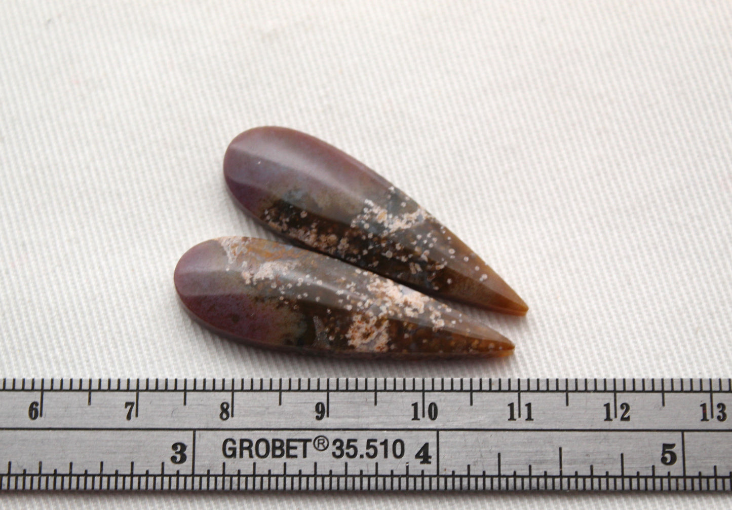 Pair of Petrified Wood Cisero Cabochons purple