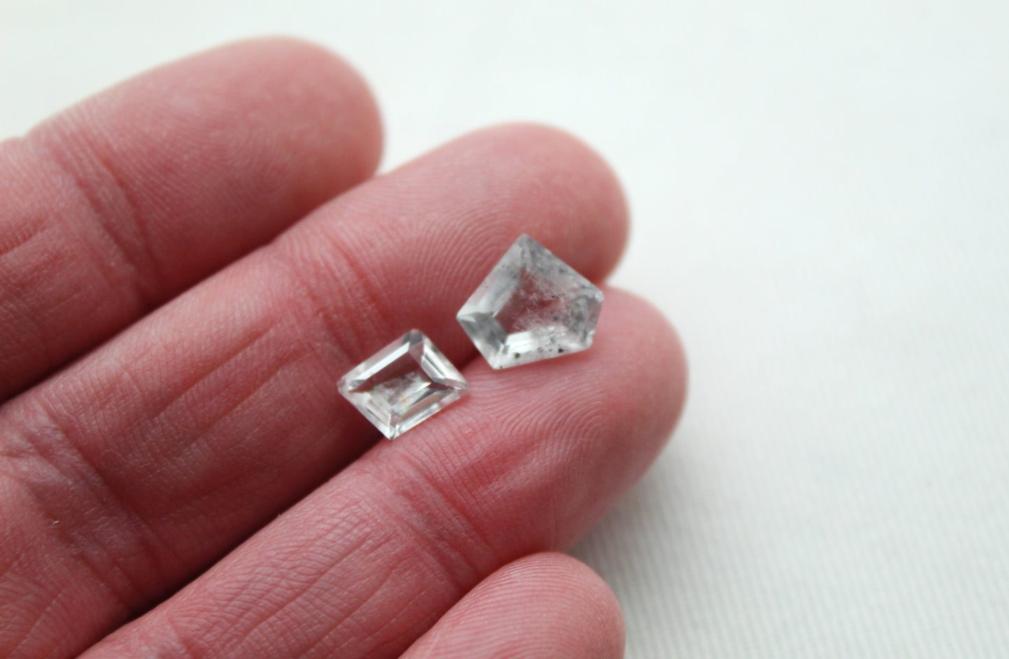 TWO Faceted Hollandite in Quartz freeform Gemstone clear