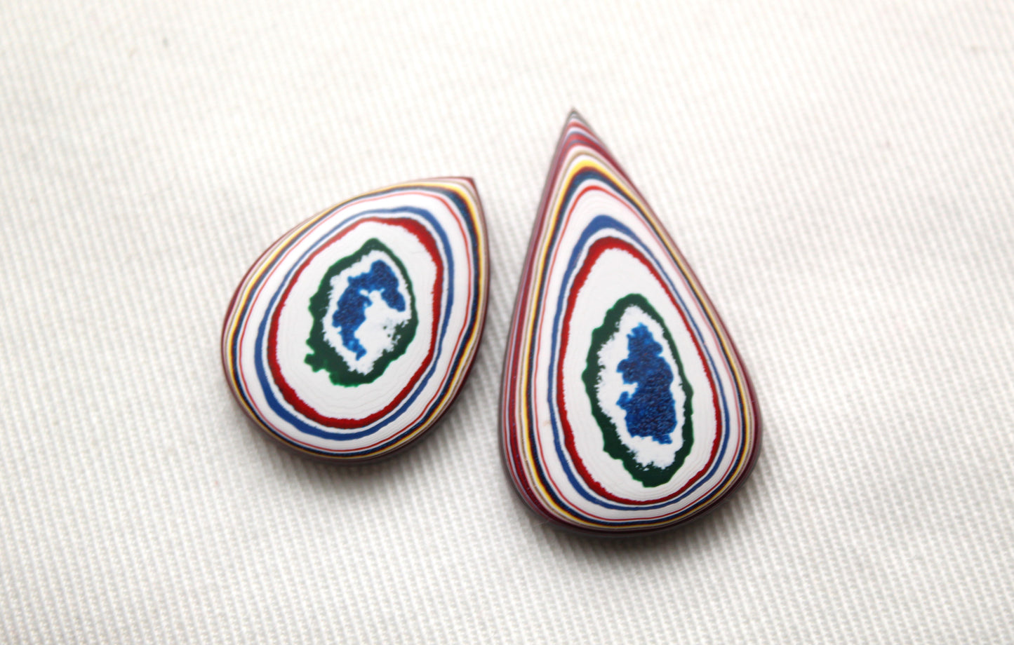 TWO Fordite Cabochon white red blue