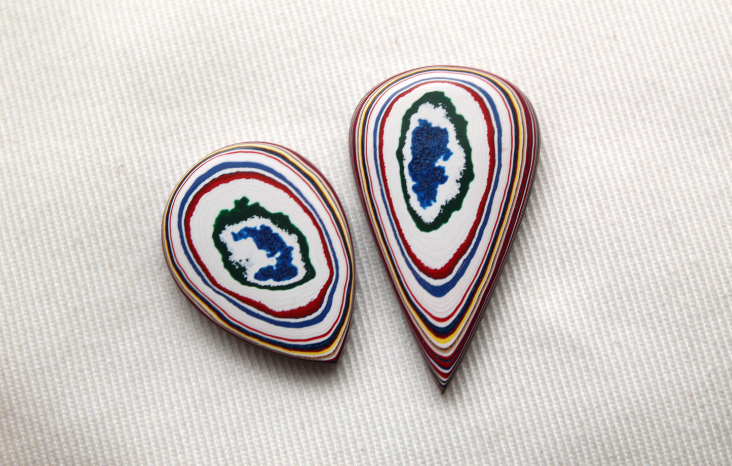 TWO Fordite Cabochon white red blue