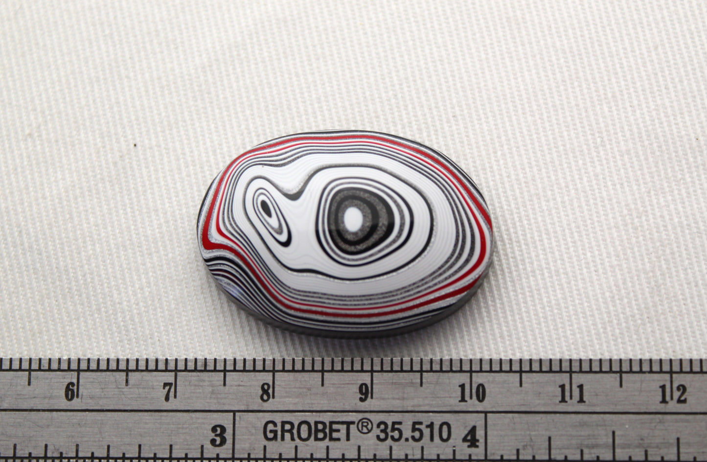 Fordite Cabochon oval white green black