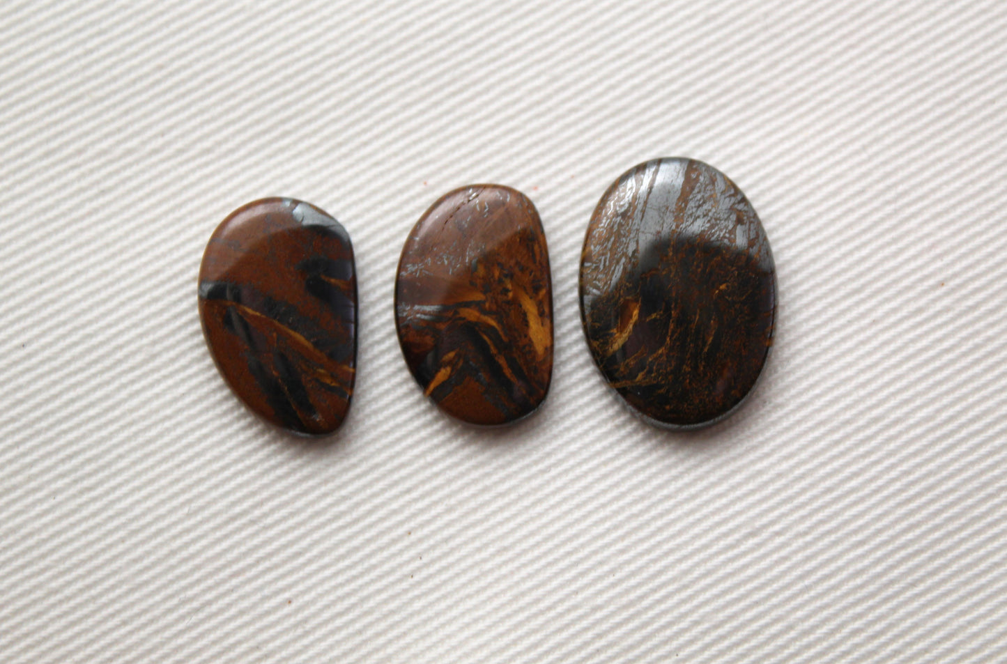 Lot of three THIN cabochons of Hematite Tiger Eye freeform