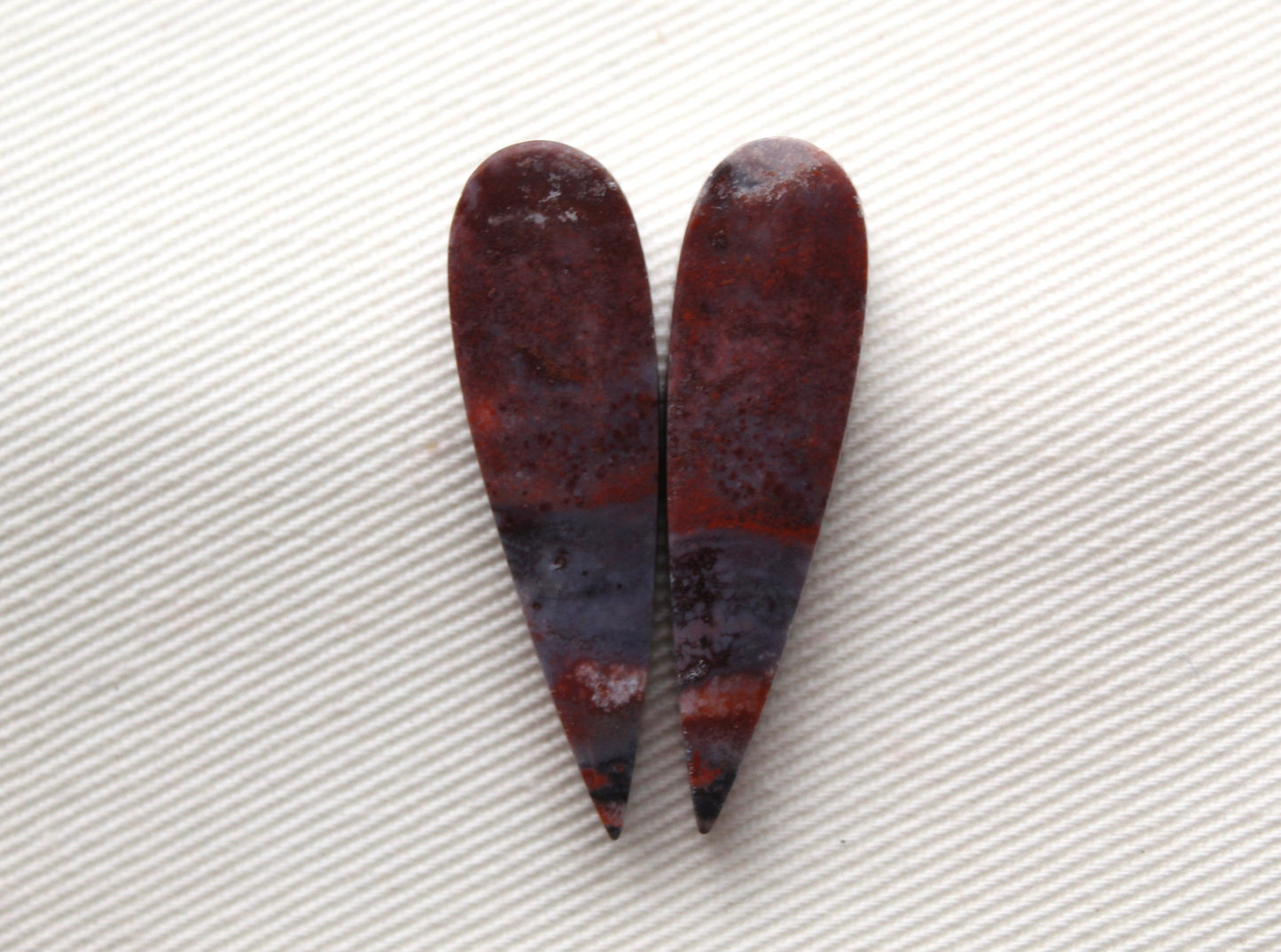 Small pair of Petrified Wood Cisero Cabochons purple