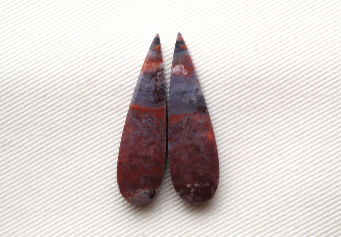 Small pair of Petrified Wood Cisero Cabochons purple