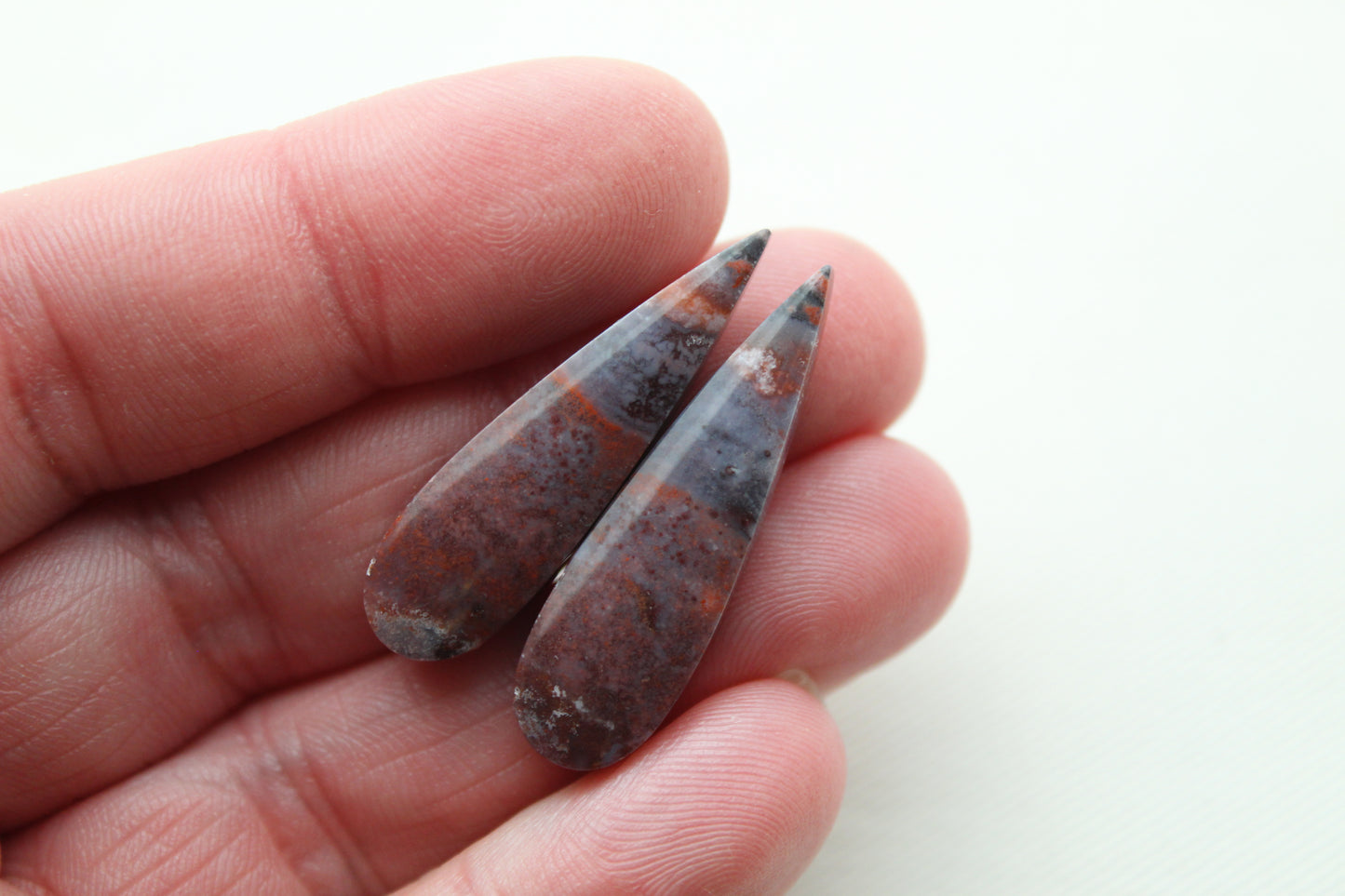 Small pair of Petrified Wood Cisero Cabochons purple