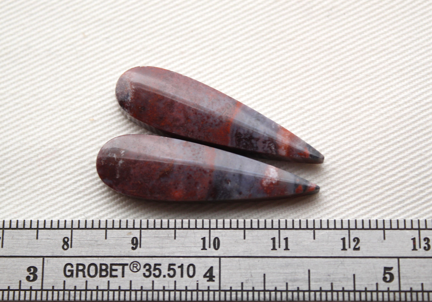 Small pair of Petrified Wood Cisero Cabochons purple