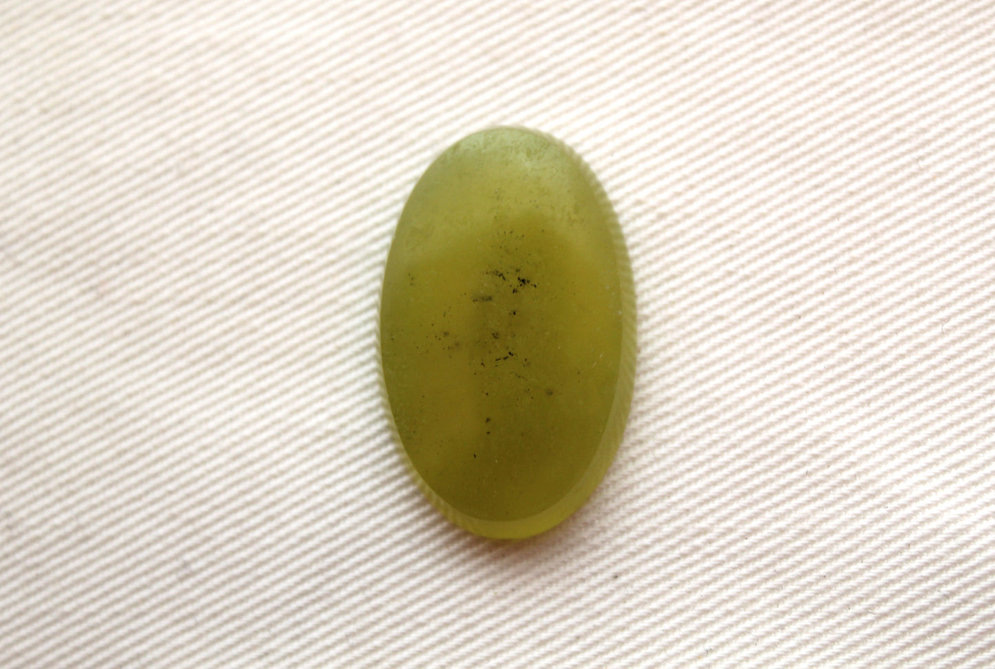 One Vesuvianite Cabochon Gemstone light green Oval