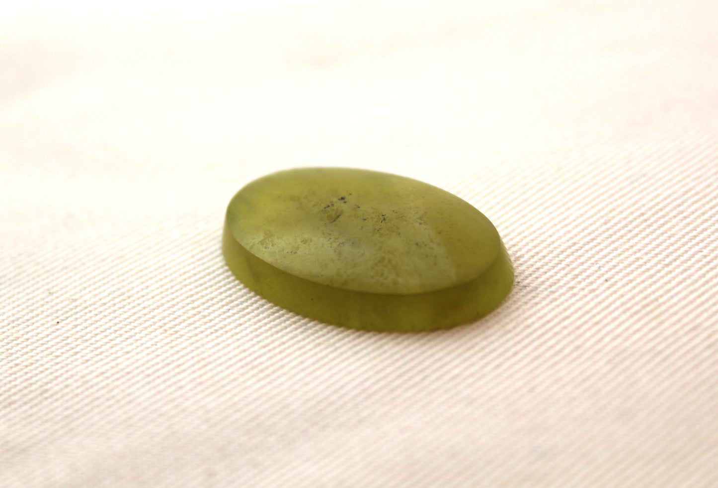 One Vesuvianite Cabochon Gemstone light green Oval