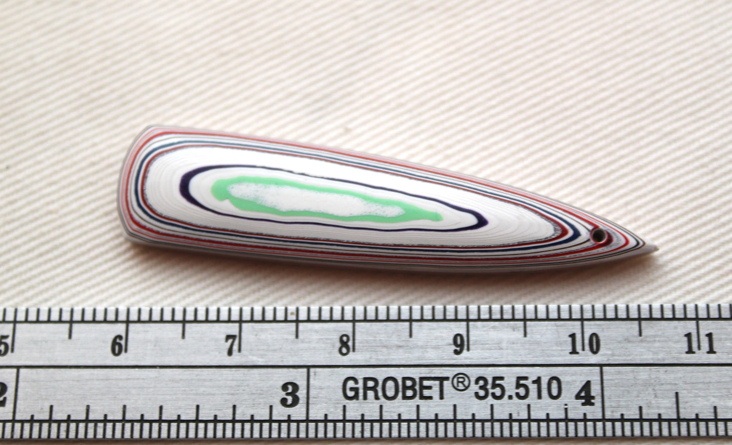 Long DRILLED piece of Fordite white red green