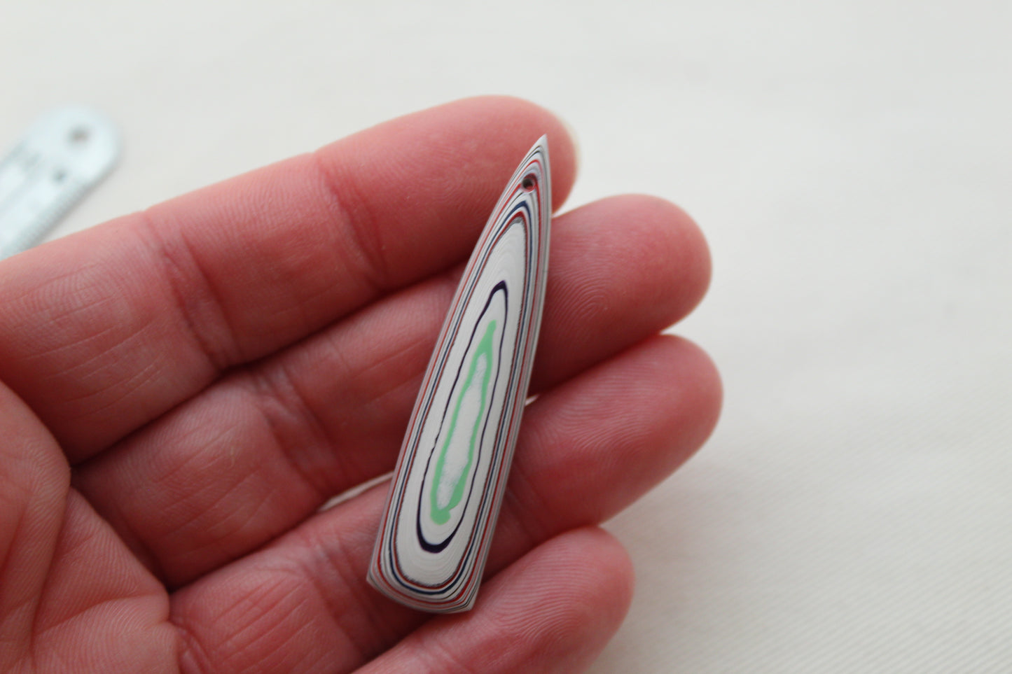 Long DRILLED piece of Fordite white red green