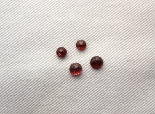 FOUR tiny Garnet rose cut round cabochons