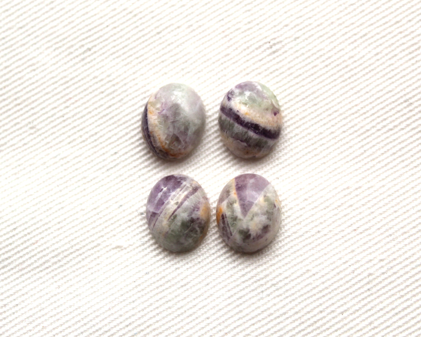 FOUR amethyst Chevron oval cabochons 9X11MM