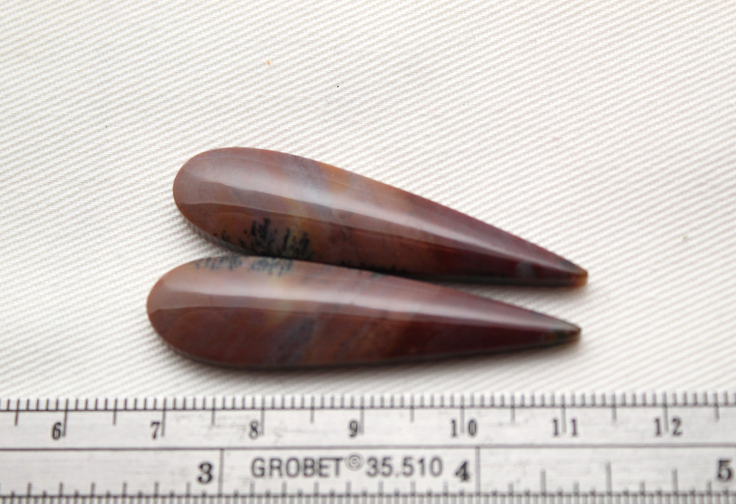 Long Pair of Petrified Wood Cisero Cabochons