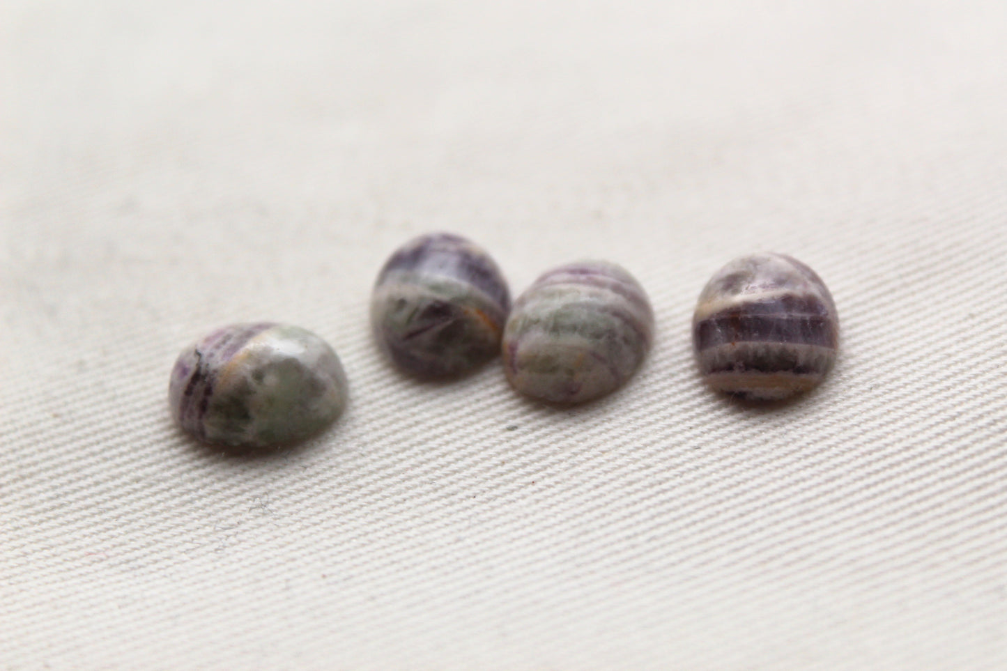 FOUR amethyst Chevron oval cabochons 9X11MM