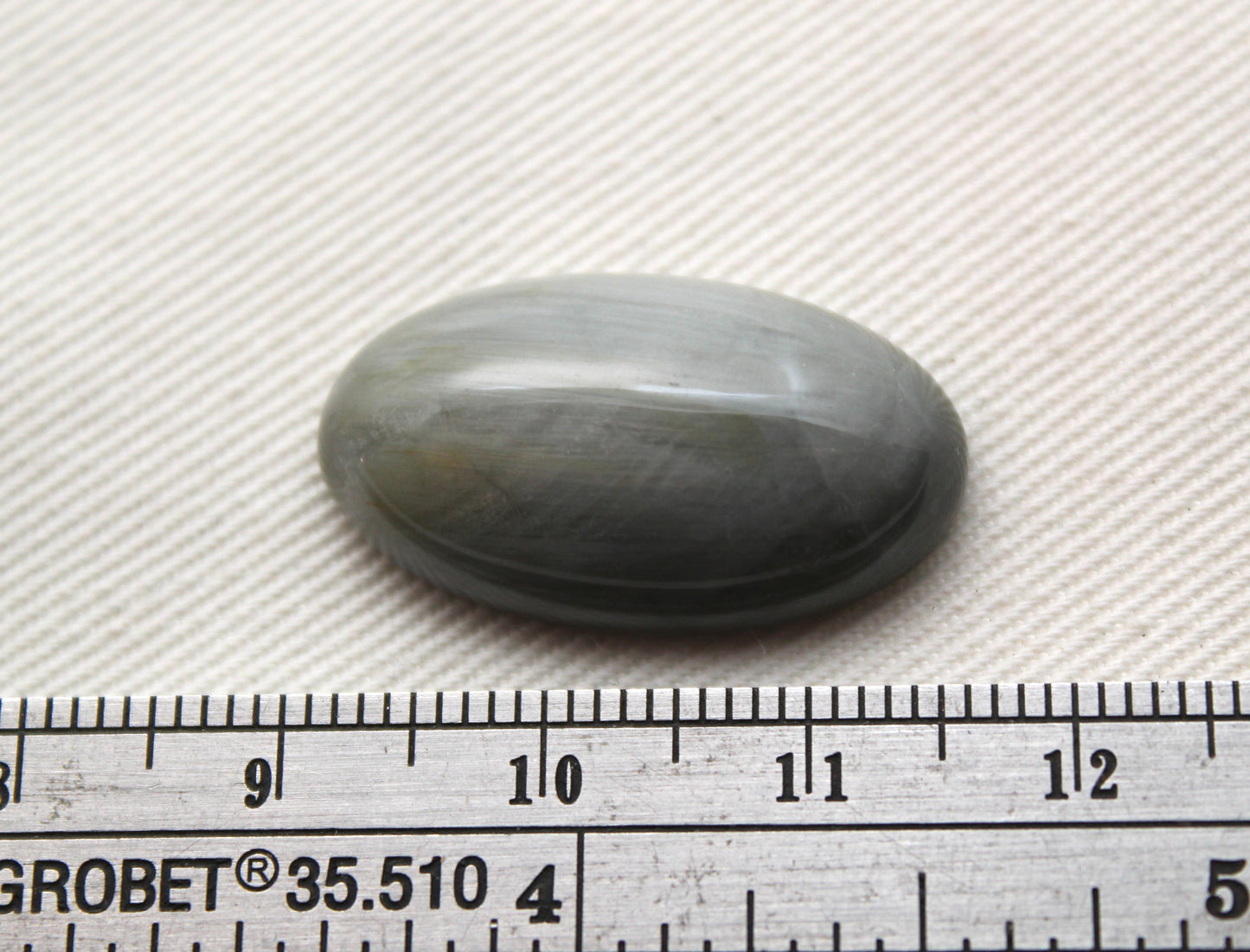 Un cabochon oeil de crapaud Gemstone gris ovale 14X25MM
