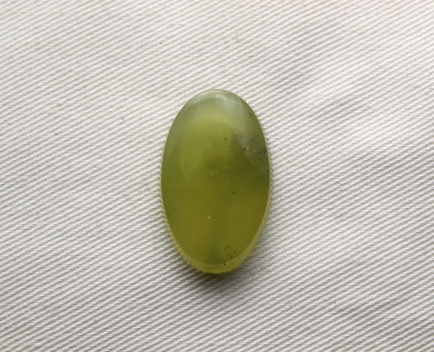 One Vesuvianite Cabochon Gemstone light green Oval