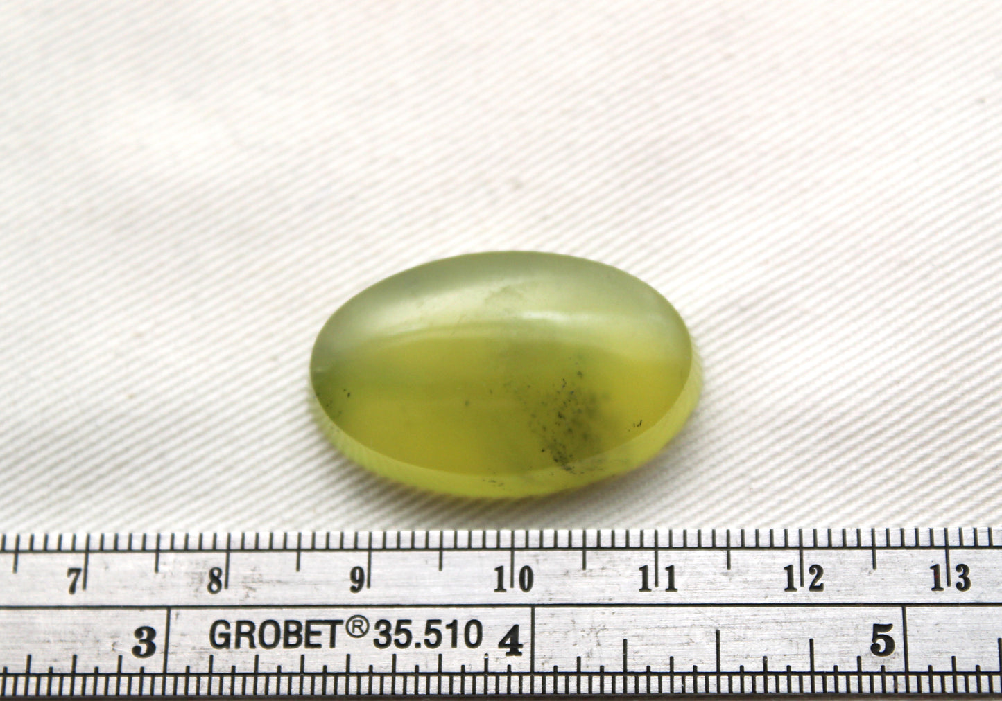 One Vesuvianite Cabochon Gemstone light green Oval