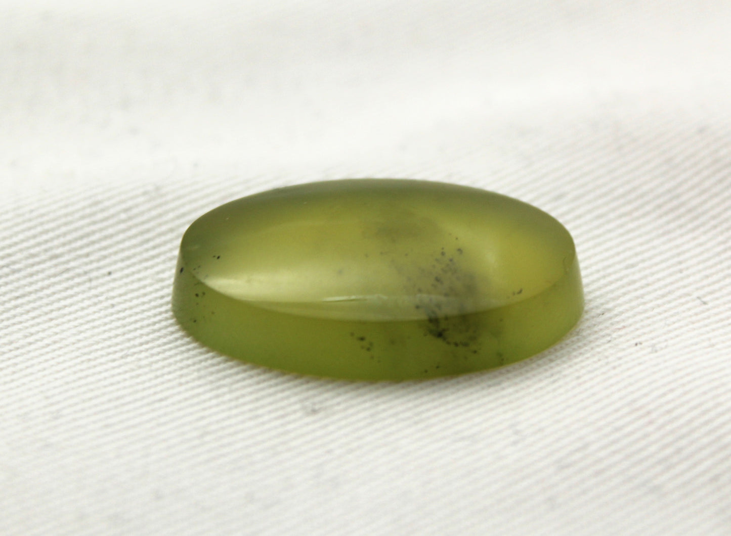 One Vesuvianite Cabochon Gemstone light green Oval