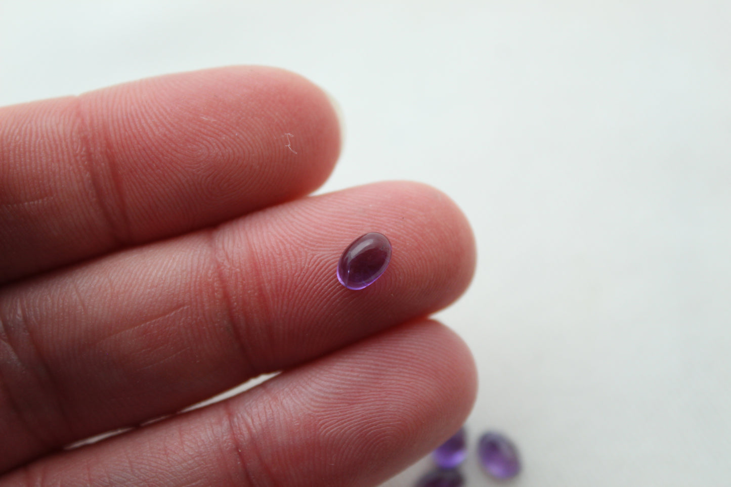 FOUR tiny amethyst oval cabochons 6X4MM