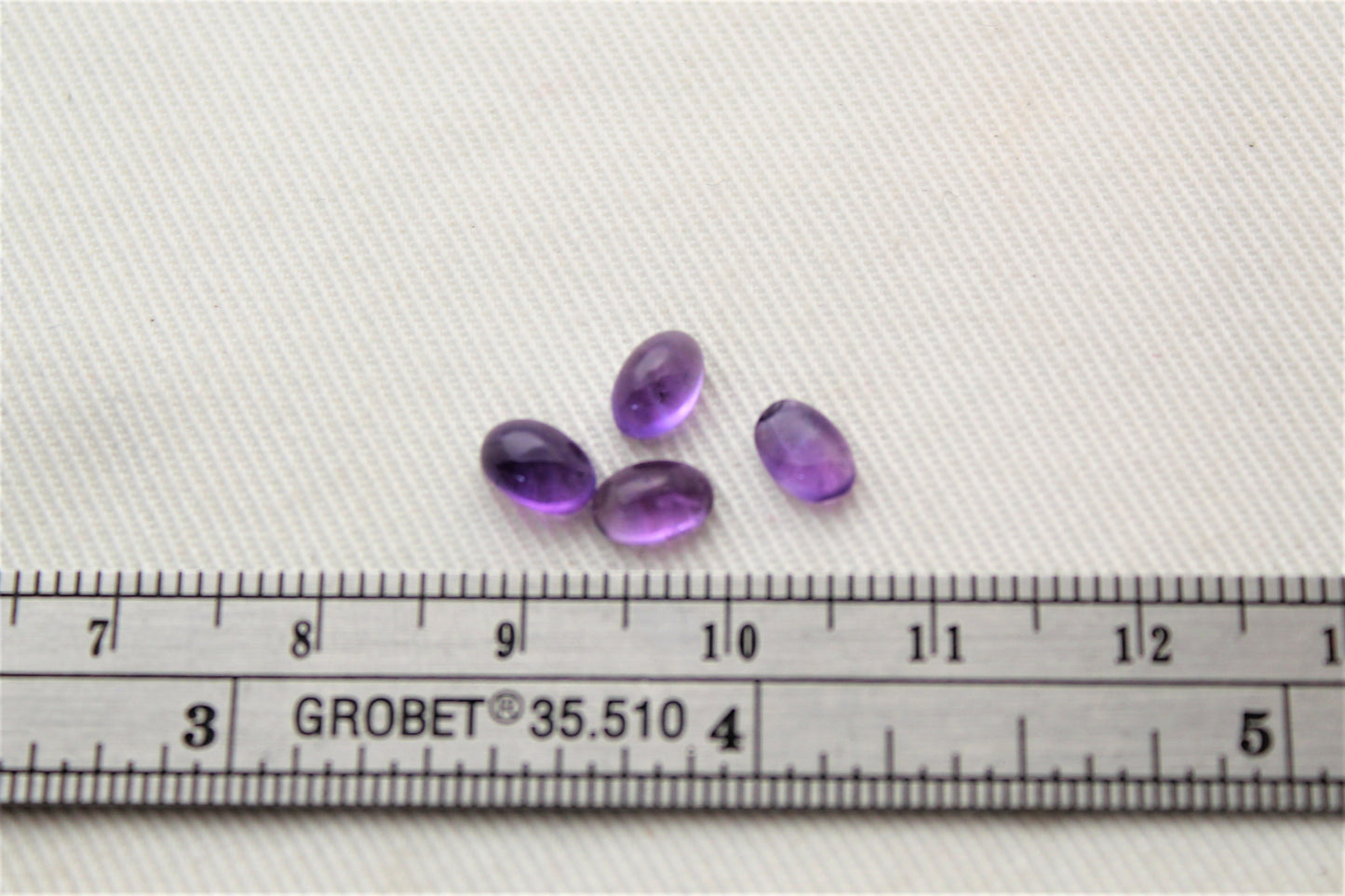 FOUR tiny amethyst oval cabochons 6X4MM