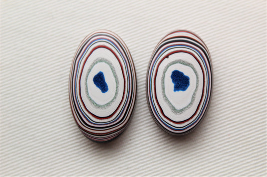 TWO Fordite Cabochon white red green teardrop