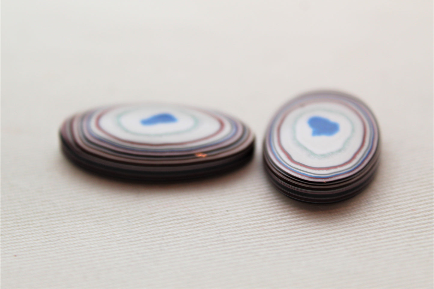 TWO Fordite Cabochon white red green teardrop