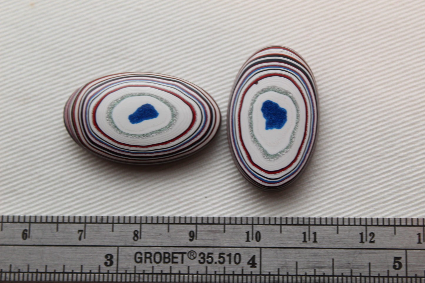 TWO Fordite Cabochon white red green teardrop