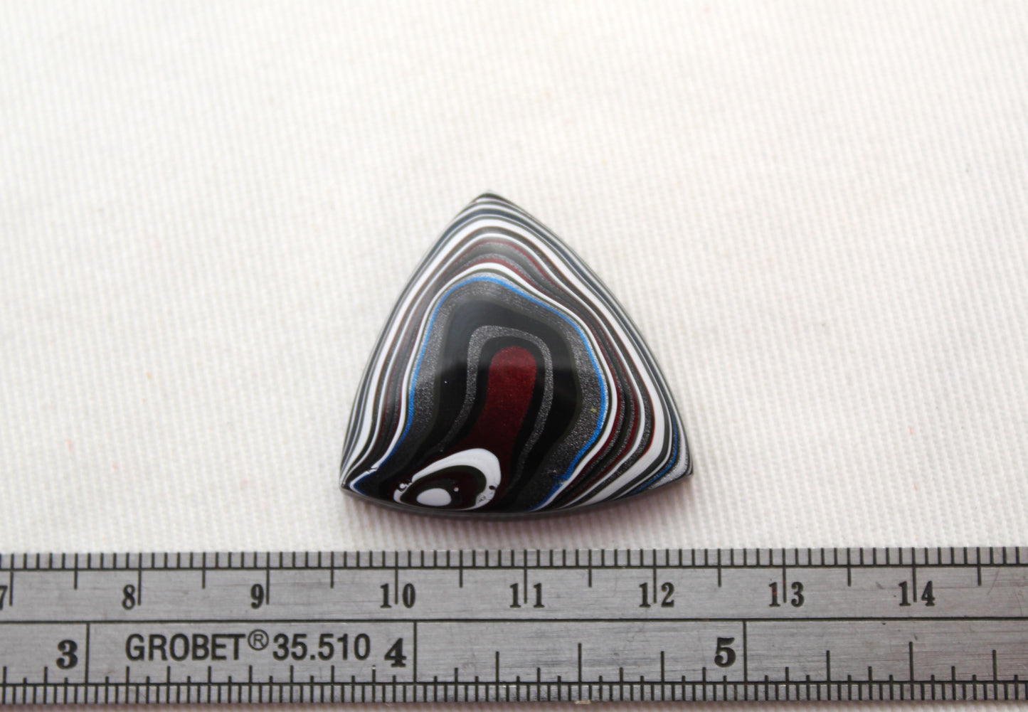 Trillion Fordite Cabochon white red black blue