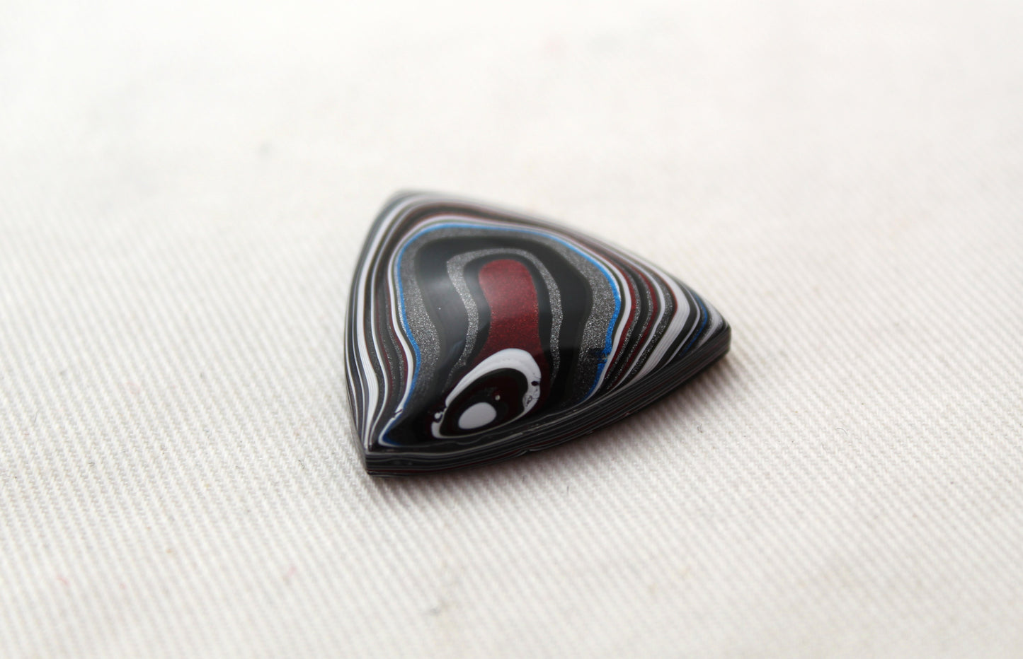 Trillion Fordite Cabochon white red black blue