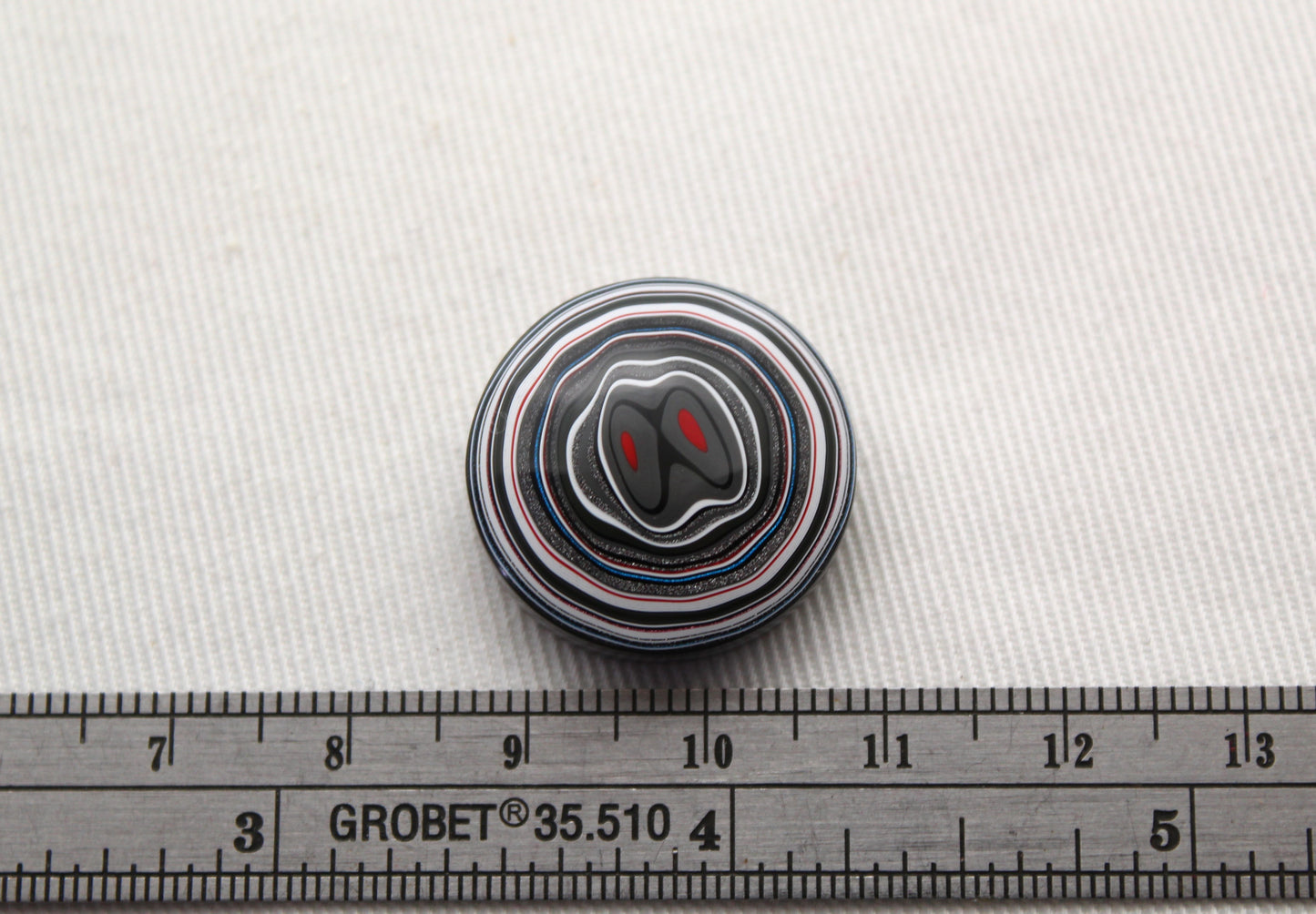 Fordite Cabochon round red black white 22MM