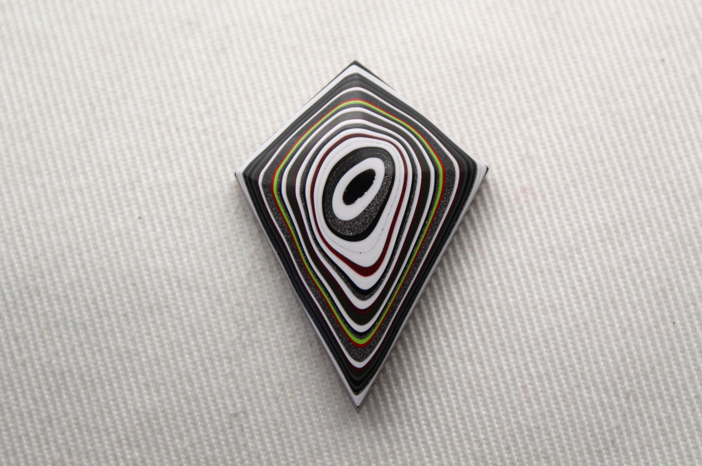 Kite shape Fordite Cabochon white red black green