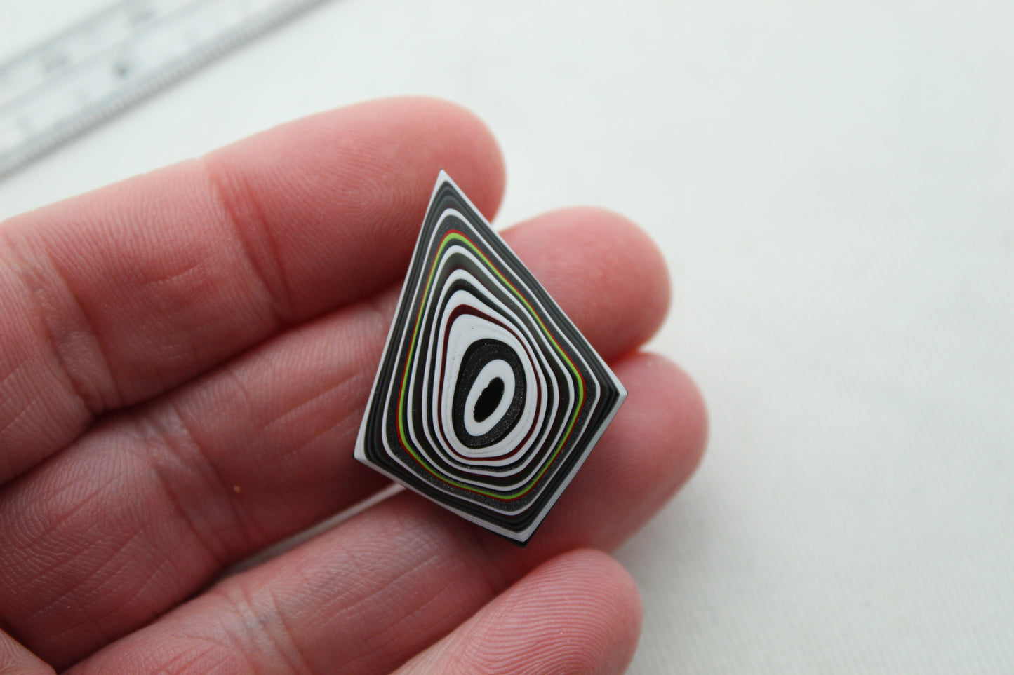 Kite shape Fordite Cabochon white red black green