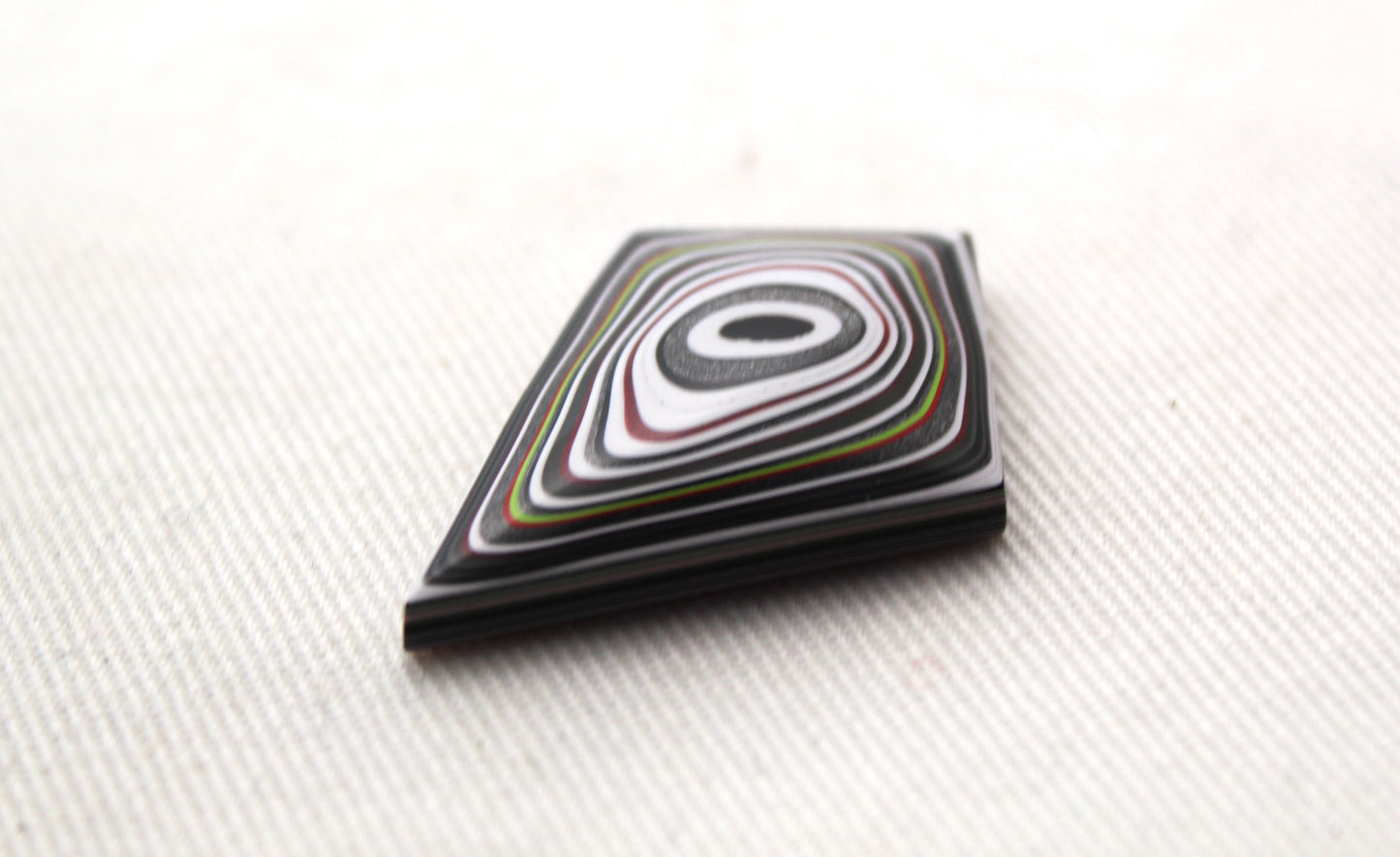 Kite shape Fordite Cabochon white red black green