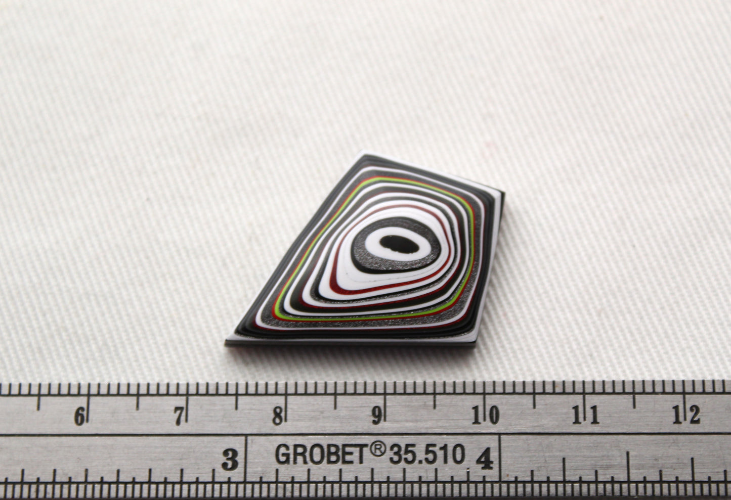 Kite shape Fordite Cabochon white red black green