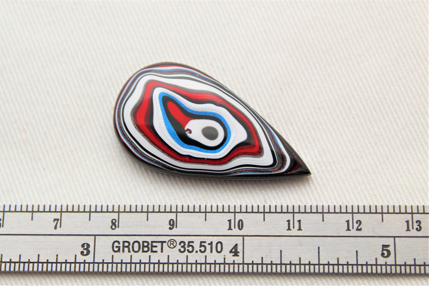 Fordite Cabochon teardrop white red