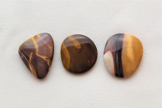 Lot of three mookaite cabochons freeform Gemstones purple