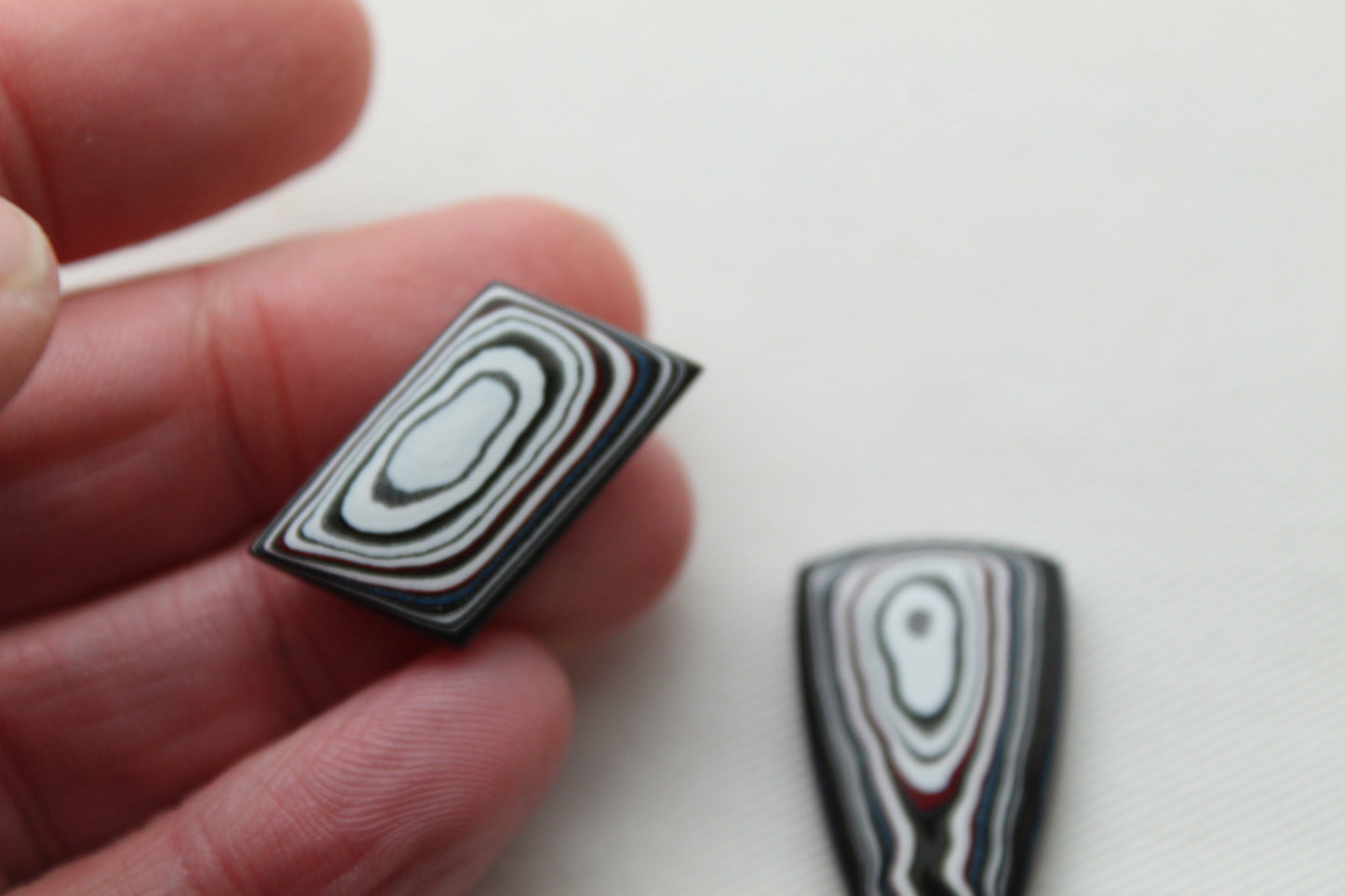 TWO Fordite Cabochon white red black mismatched