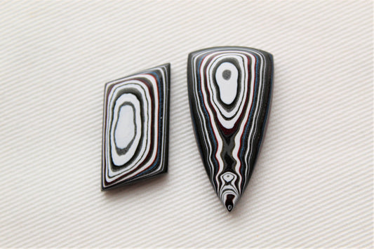 TWO Fordite Cabochon white red black mismatched