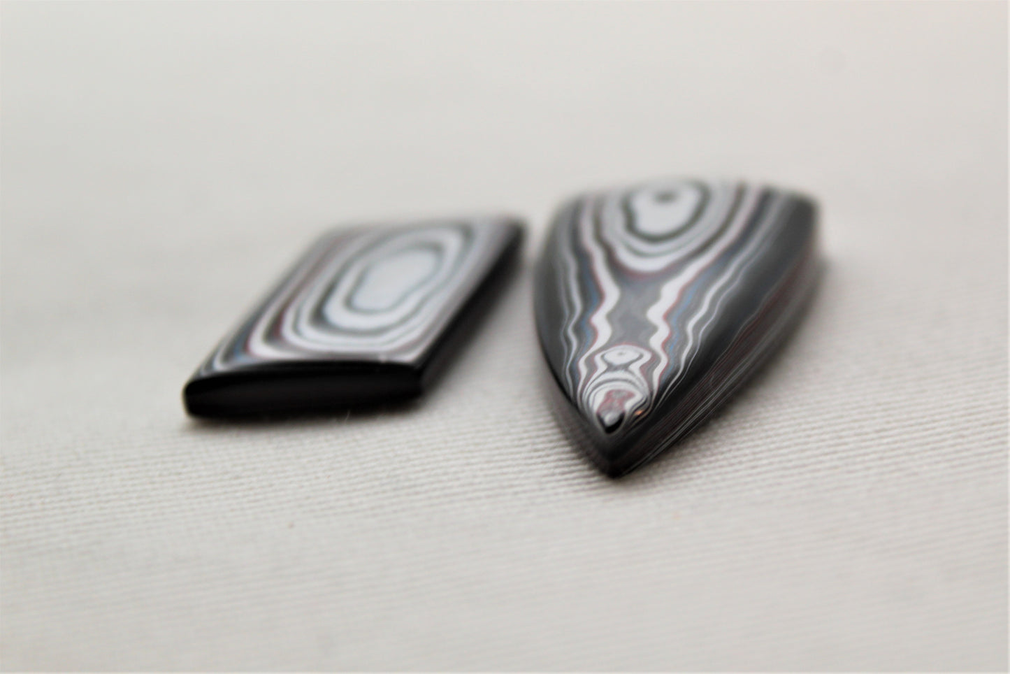 TWO Fordite Cabochon white red black mismatched