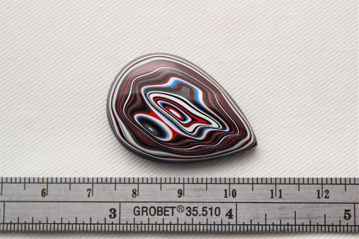 Fordite Cabochon teardrop blue black red