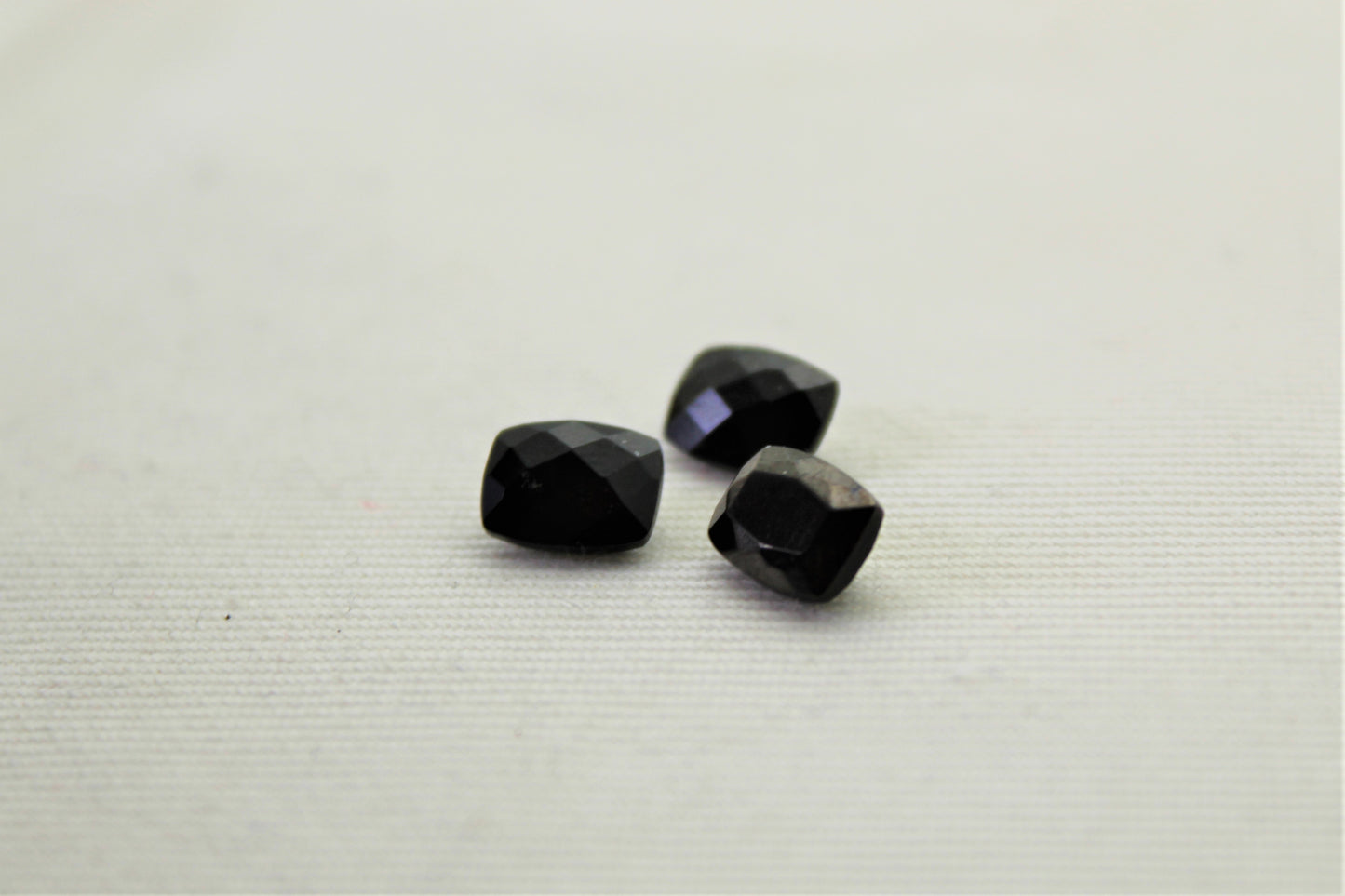 THREE faceted black Spinel gemstones rectangle cushion