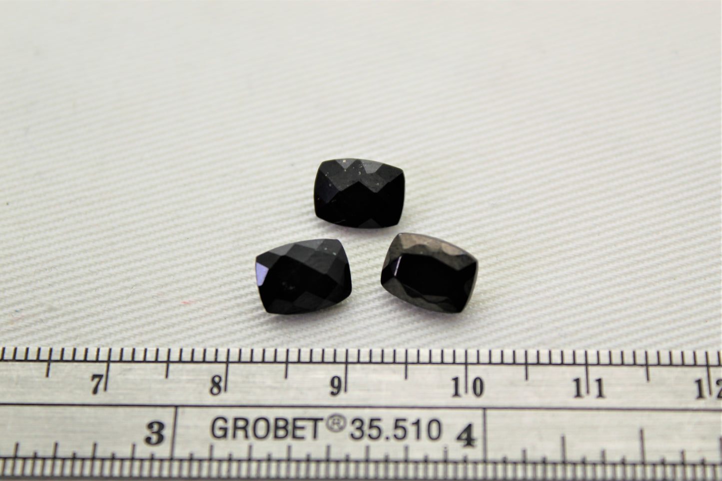 THREE faceted black Spinel gemstones rectangle cushion