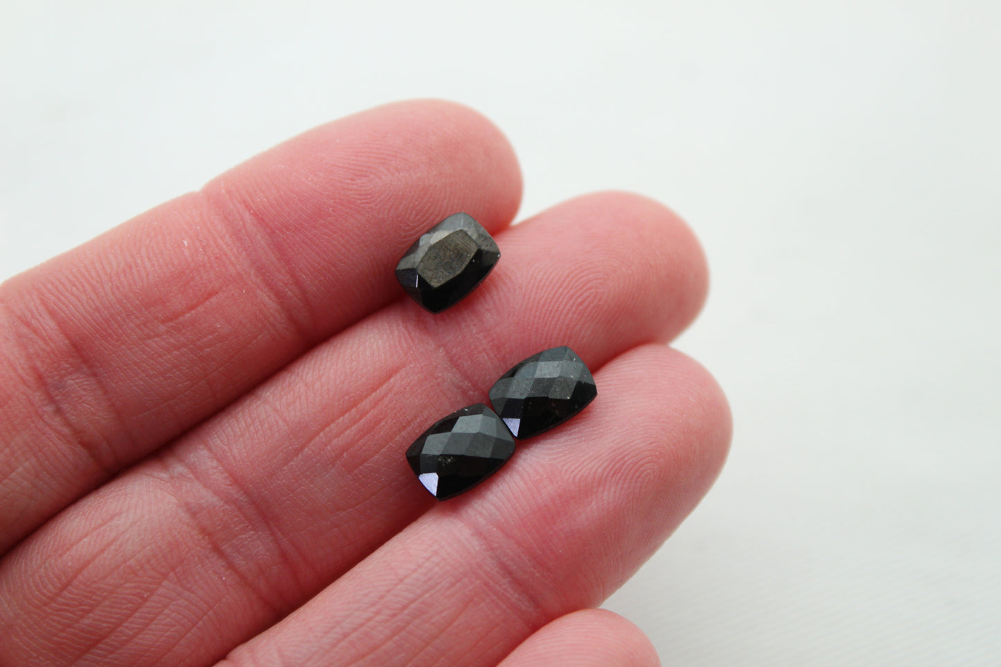 THREE faceted black Spinel gemstones rectangle cushion