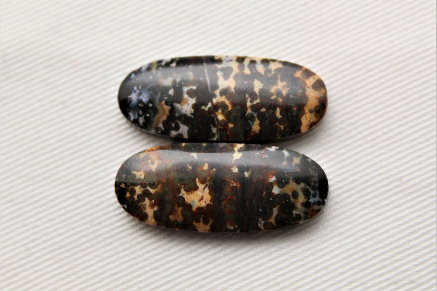 Pair of Indonesian Dark Poppy Jasper Cabochons Oval