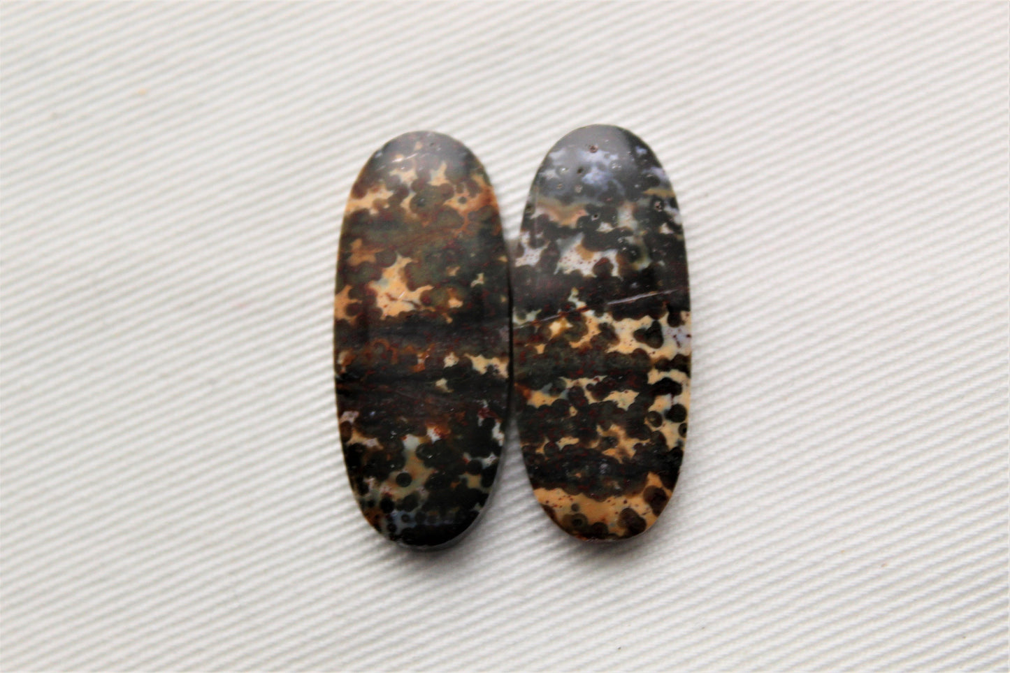 Pair of Indonesian Dark Poppy Jasper Cabochons Oval