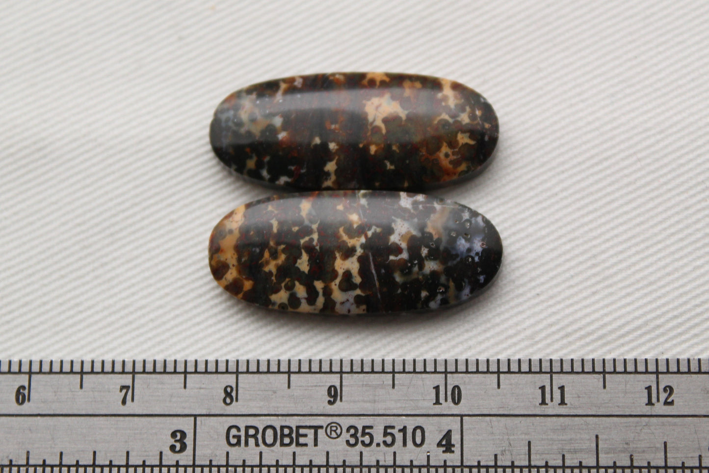 Pair of Indonesian Dark Poppy Jasper Cabochons Oval