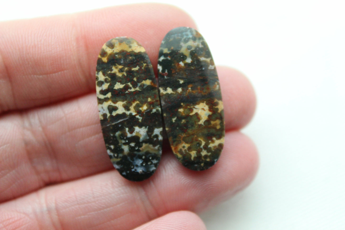 Pair of Indonesian Dark Poppy Jasper Cabochons Oval